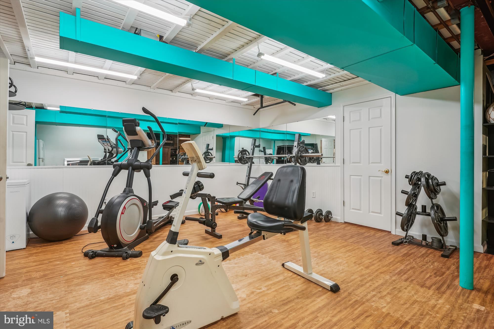 6100 Solitaire Way McLean, VA 22101 - Photo 50 of 60 a room with gym equipment and a large window