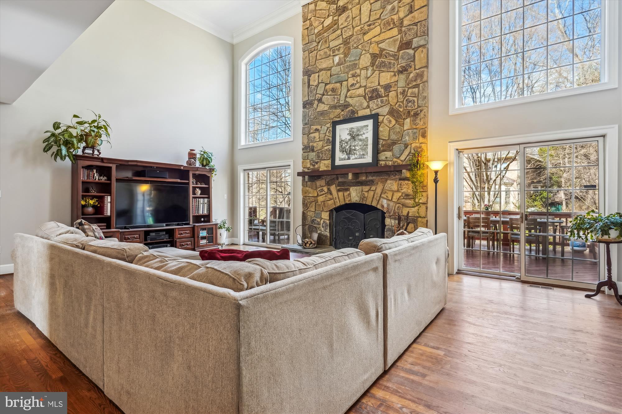 6100 Solitaire Way McLean, VA 22101 - Photo 9 of 60 a living room with furniture a fireplace and a flat screen tv