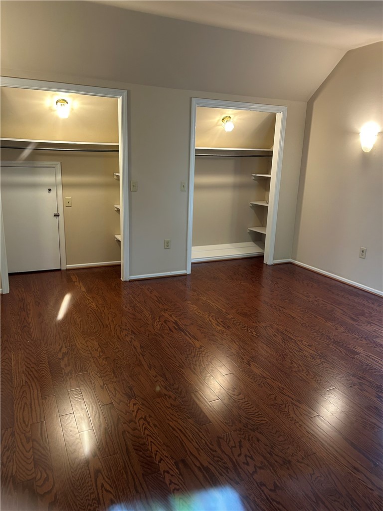 110 North Broad Street Pendleton, SC 29670 - Photo 23 of 32 Well-lit room featuring rich hardwood flooring and convenient closet space.