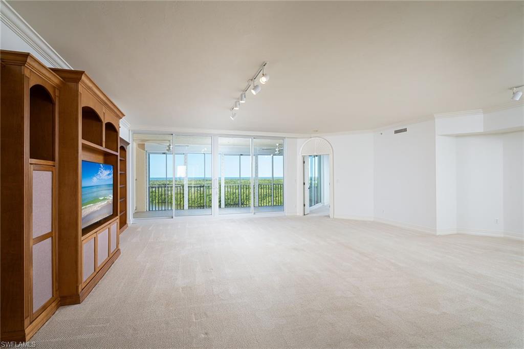 435 Dockside Drive, Unit B703 Naples, FL 34110 - Photo 4 of 38 a view of an empty room with a window