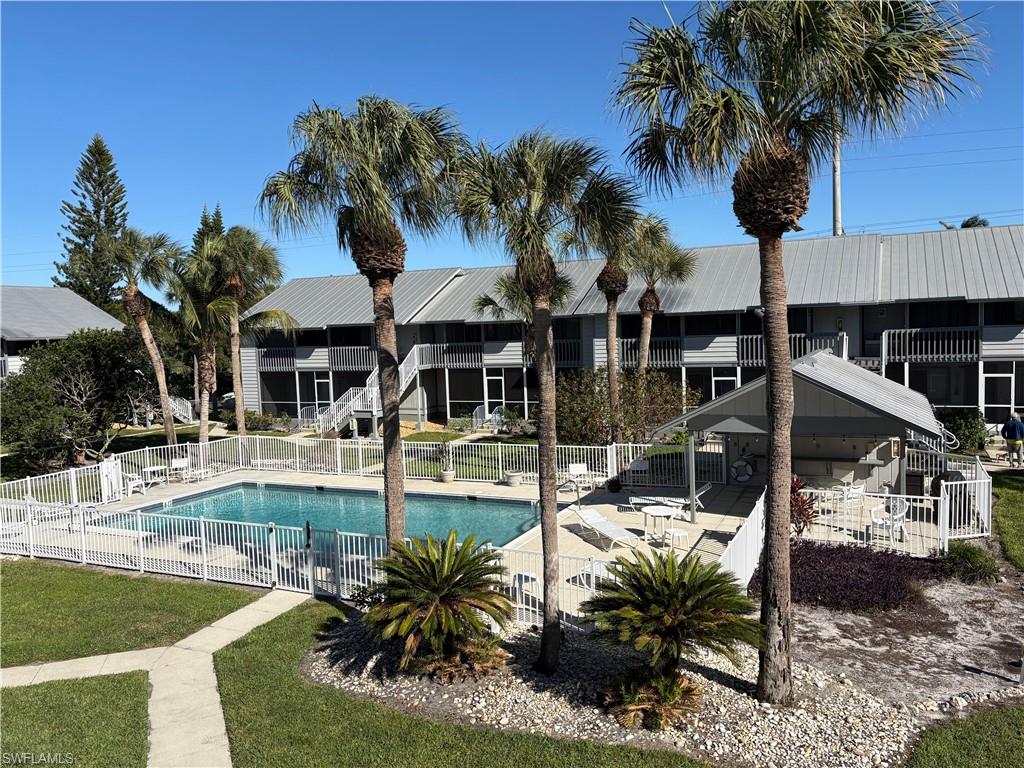a view of a swimming pool with chairs