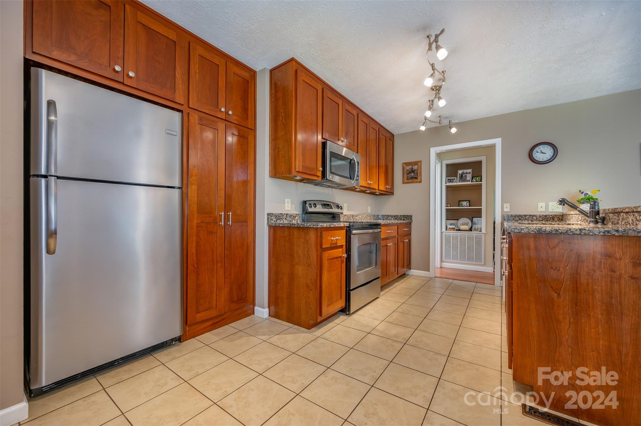 467 Lake Sandy Plains Road Tryon, NC 28782 - Photo 12 of 41 a kitchen with stainless steel appliances granite countertop a refrigerator a oven and a sink