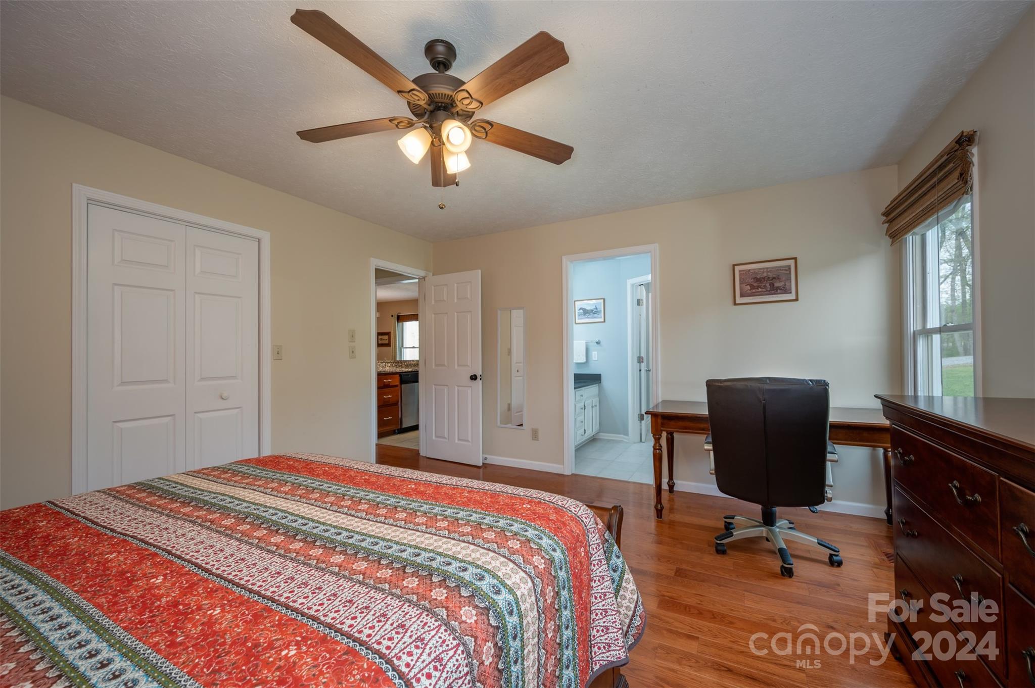 467 Lake Sandy Plains Road Tryon, NC 28782 - Photo 18 of 41 a bedroom with a bed and a chair