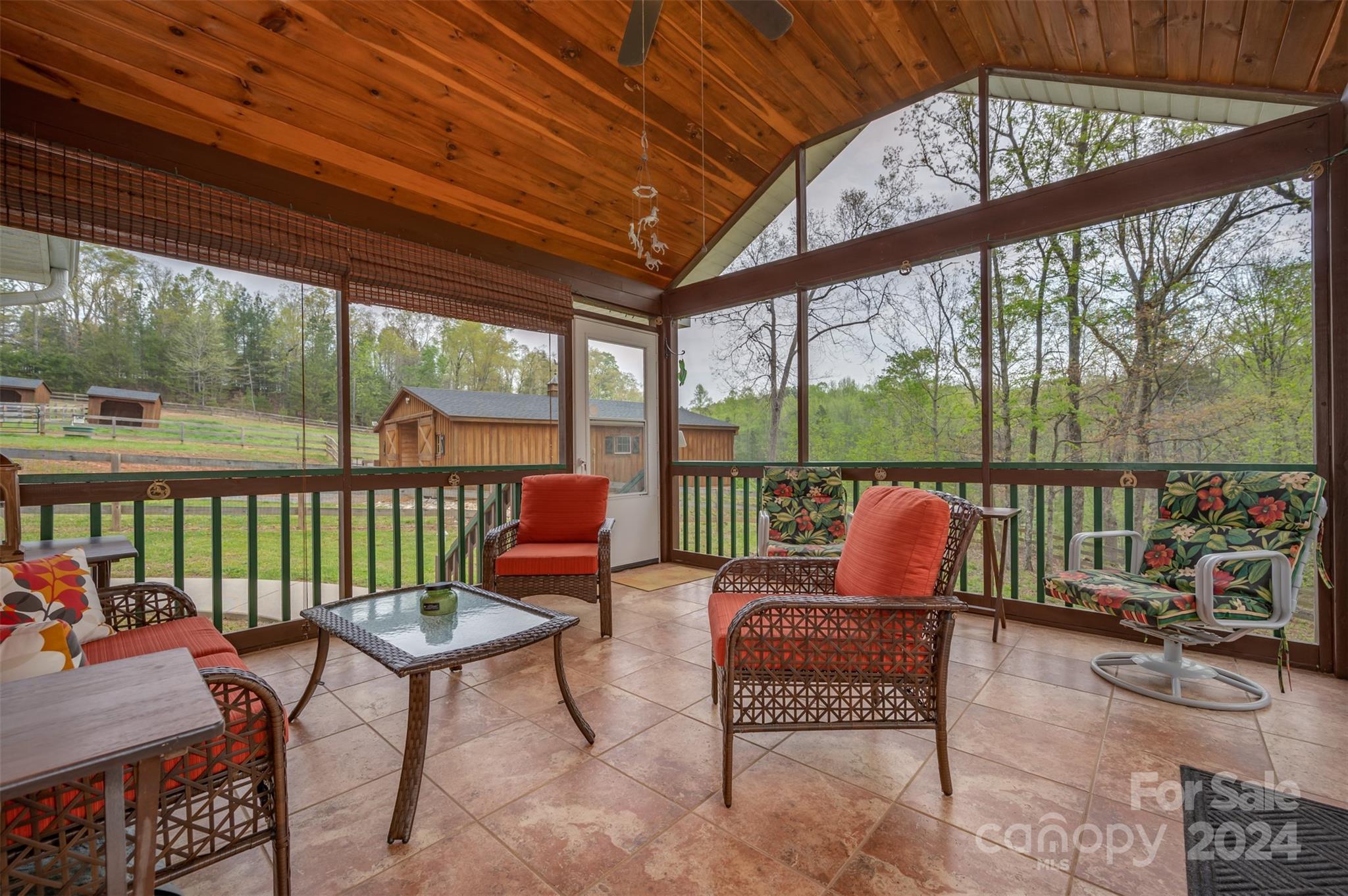 467 Lake Sandy Plains Road Tryon, NC 28782 - Photo 9 of 41 a living room with furniture and a floor to ceiling window