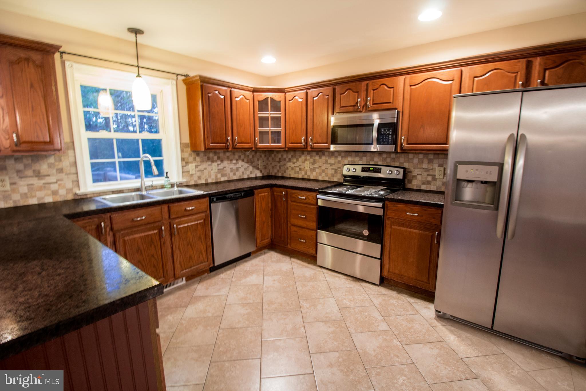 60 Covered Bridge Road Pequea, PA 17565 - Photo 11 of 32 Refrigerator is included. The stove is brand new.
