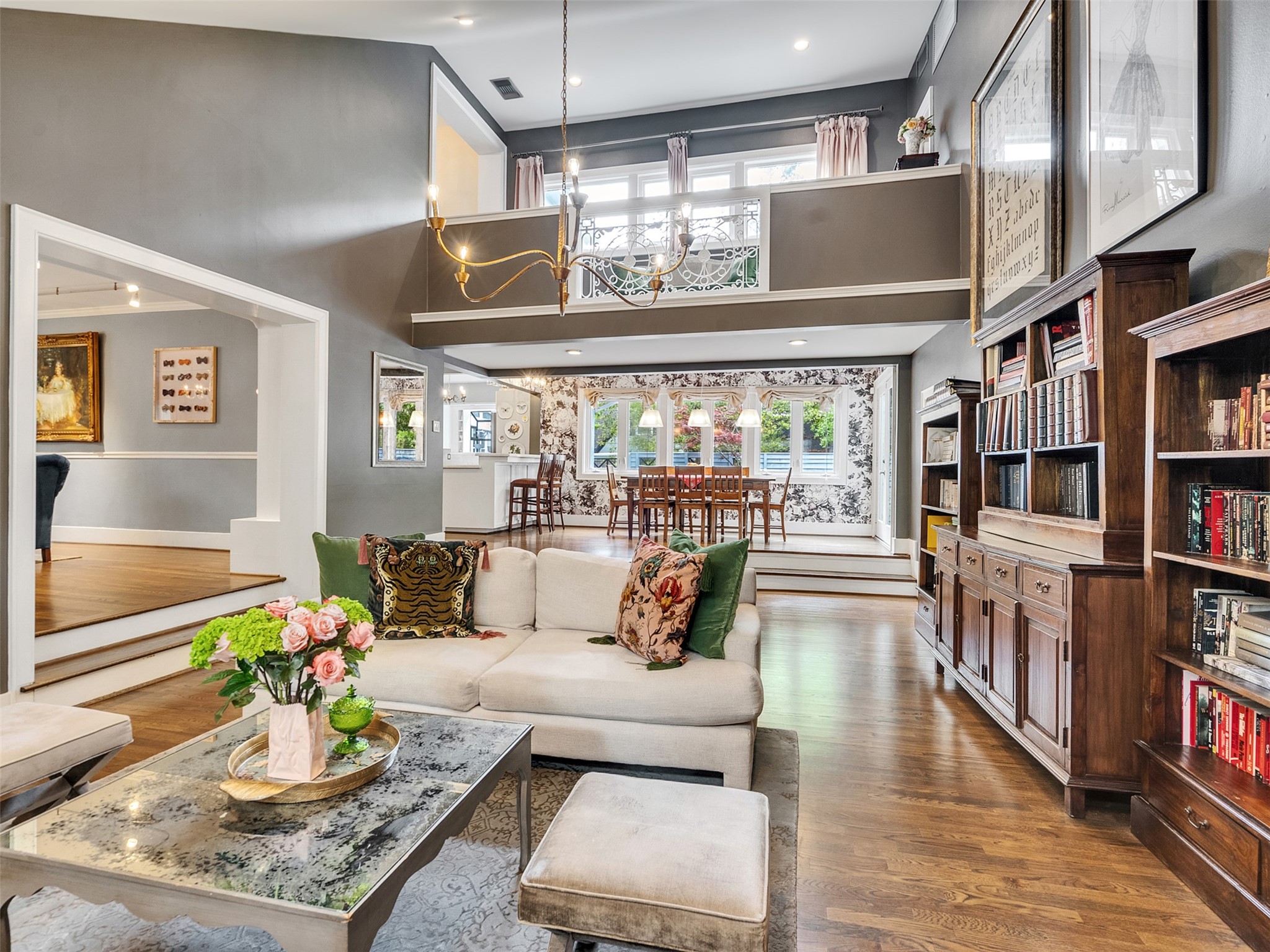 1836 Wroxton Road Houston, TX 77005 - Photo 15 of 42 Open and spacious, this family room is bright with natural light. Gorgeous architectural details seen in the second story landing. Opens off the breakfast and second dining area.