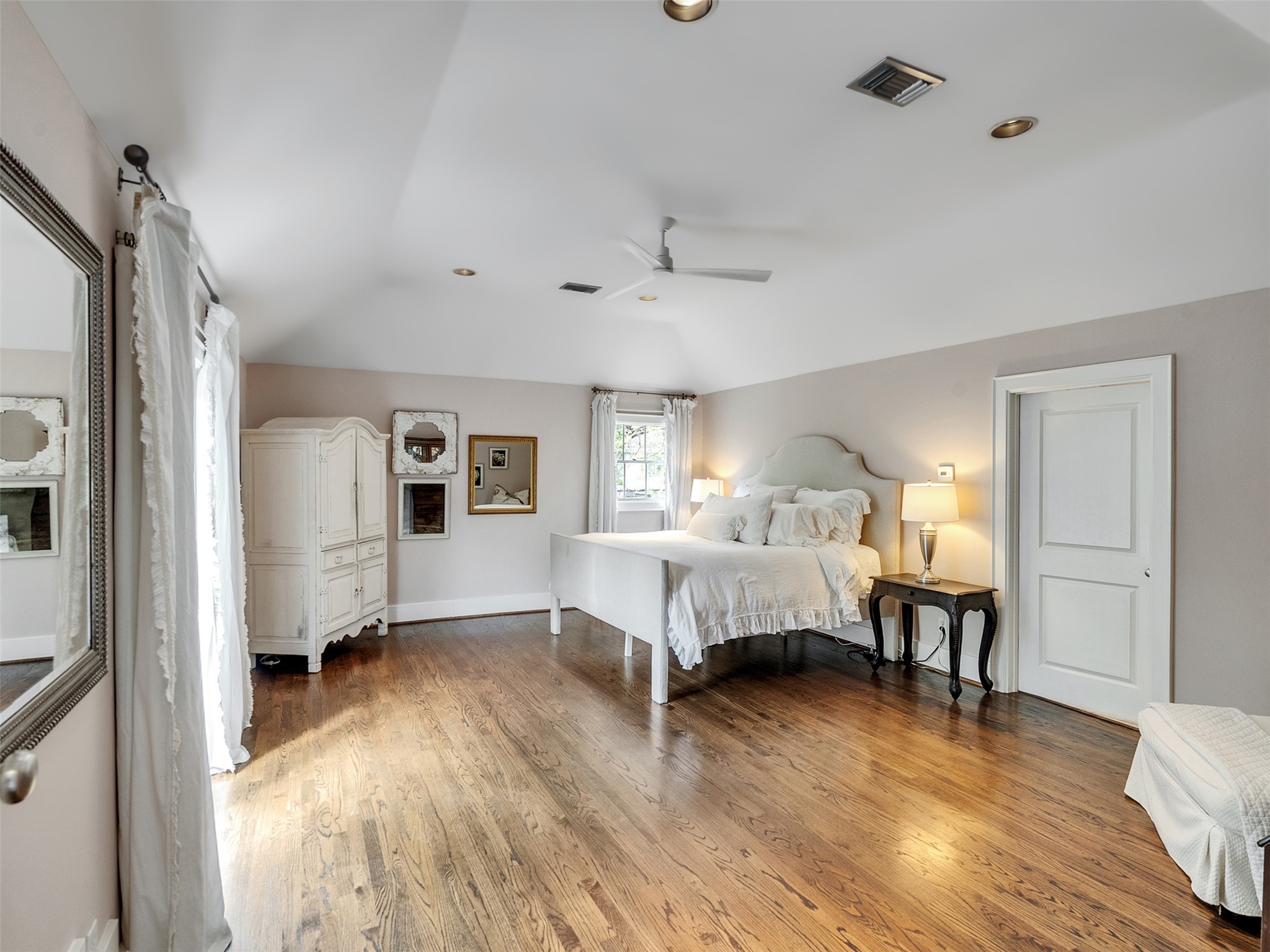 1836 Wroxton Road Houston, TX 77005 - Photo 29 of 42 Large primary bedroom with sitting area and natural light.