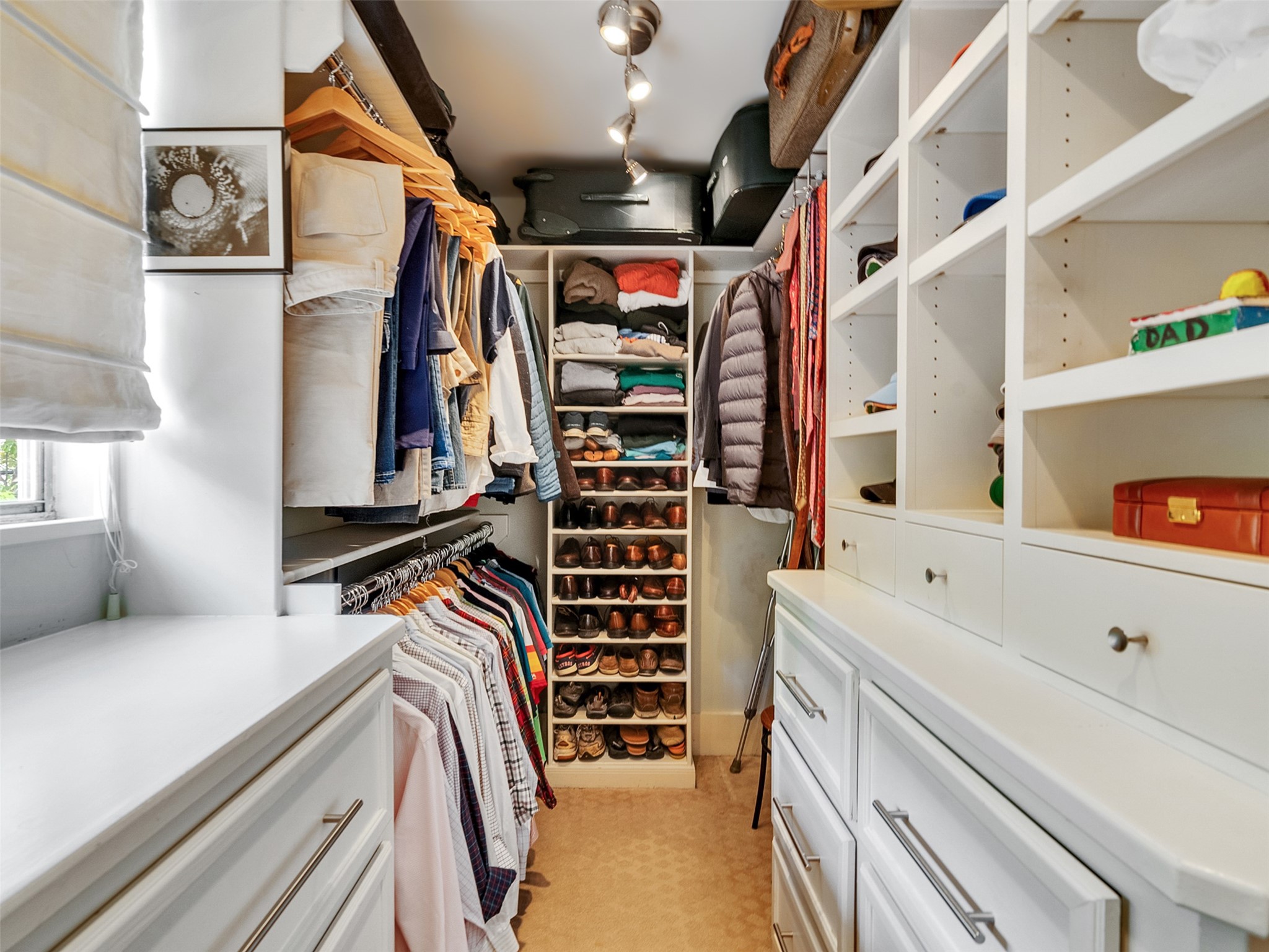 1836 Wroxton Road Houston, TX 77005 - Photo 30 of 42 Primary Walking closet with built-in drawers and storage.