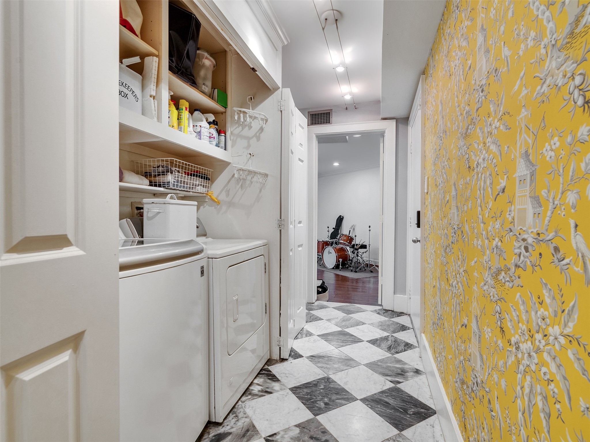 1836 Wroxton Road Houston, TX 77005 - Photo 34 of 42 Utility area with shelving and storage adjacent as well.