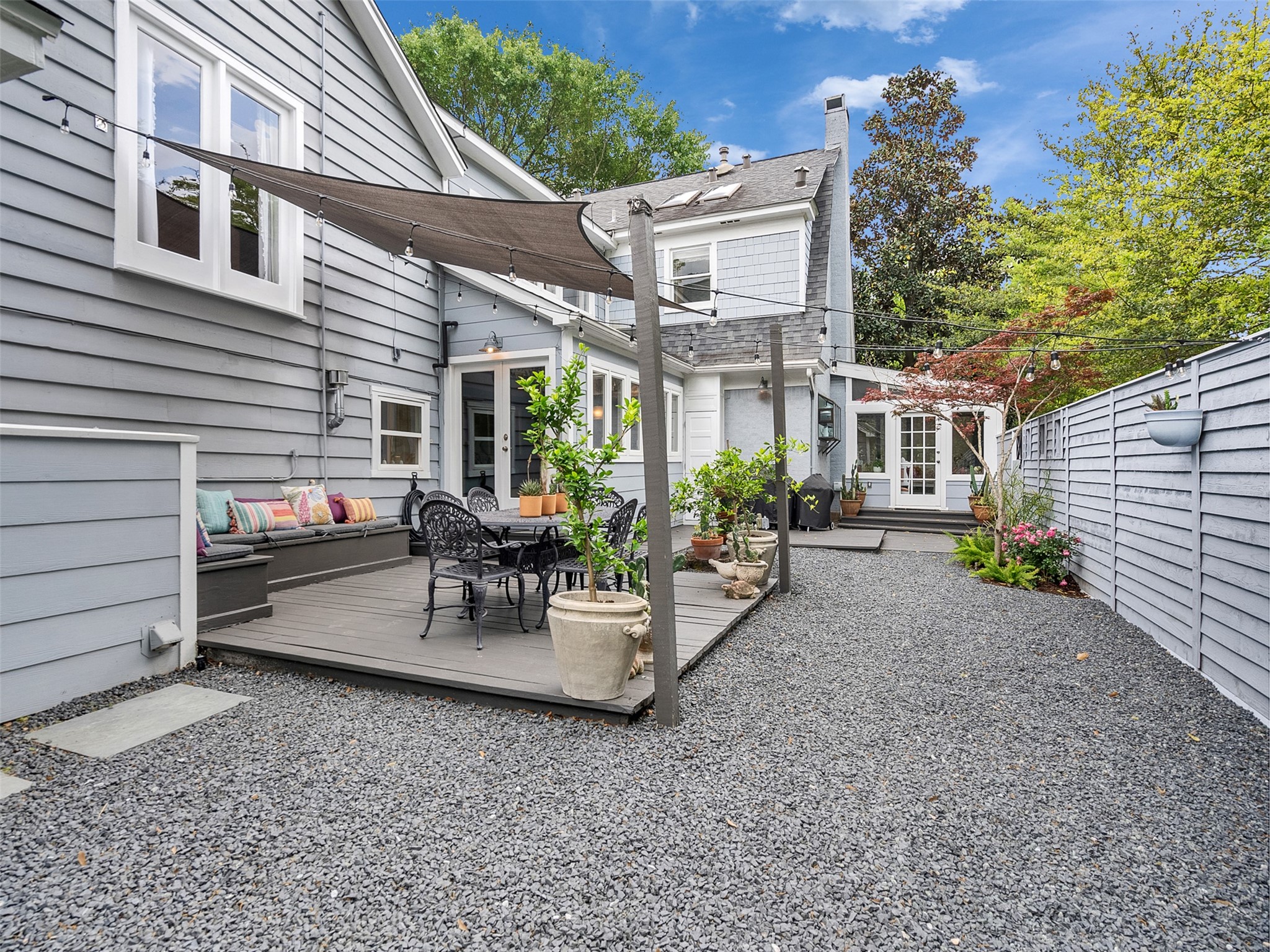 1836 Wroxton Road Houston, TX 77005 - Photo 38 of 42 Another view of the backyard, looking towards the screened porch that have double doors opening to the yard.