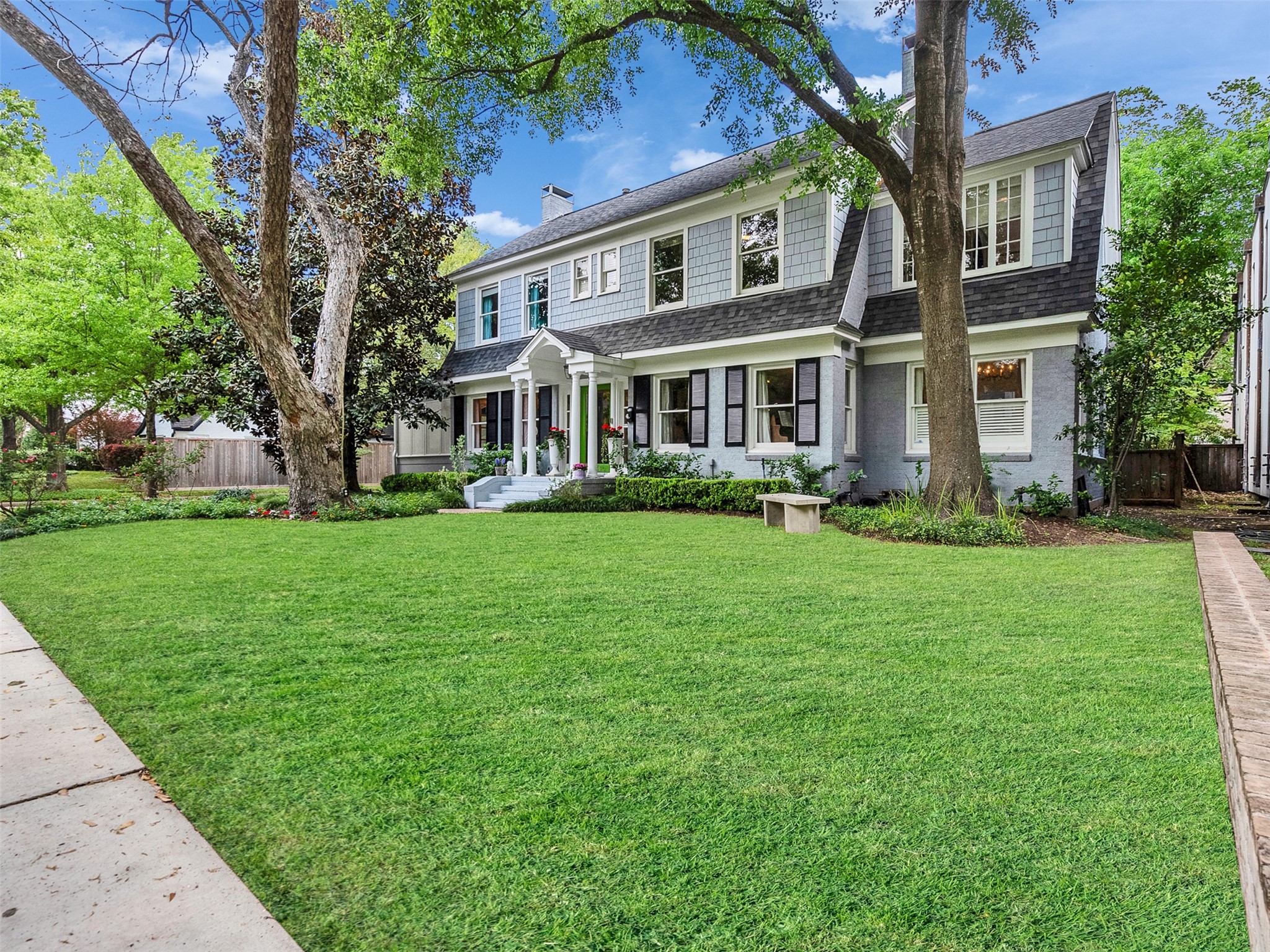 1836 Wroxton Road Houston, TX 77005 - Photo 41 of 42 Great porch, mature trees and a larger corner lot make this home truly special.
