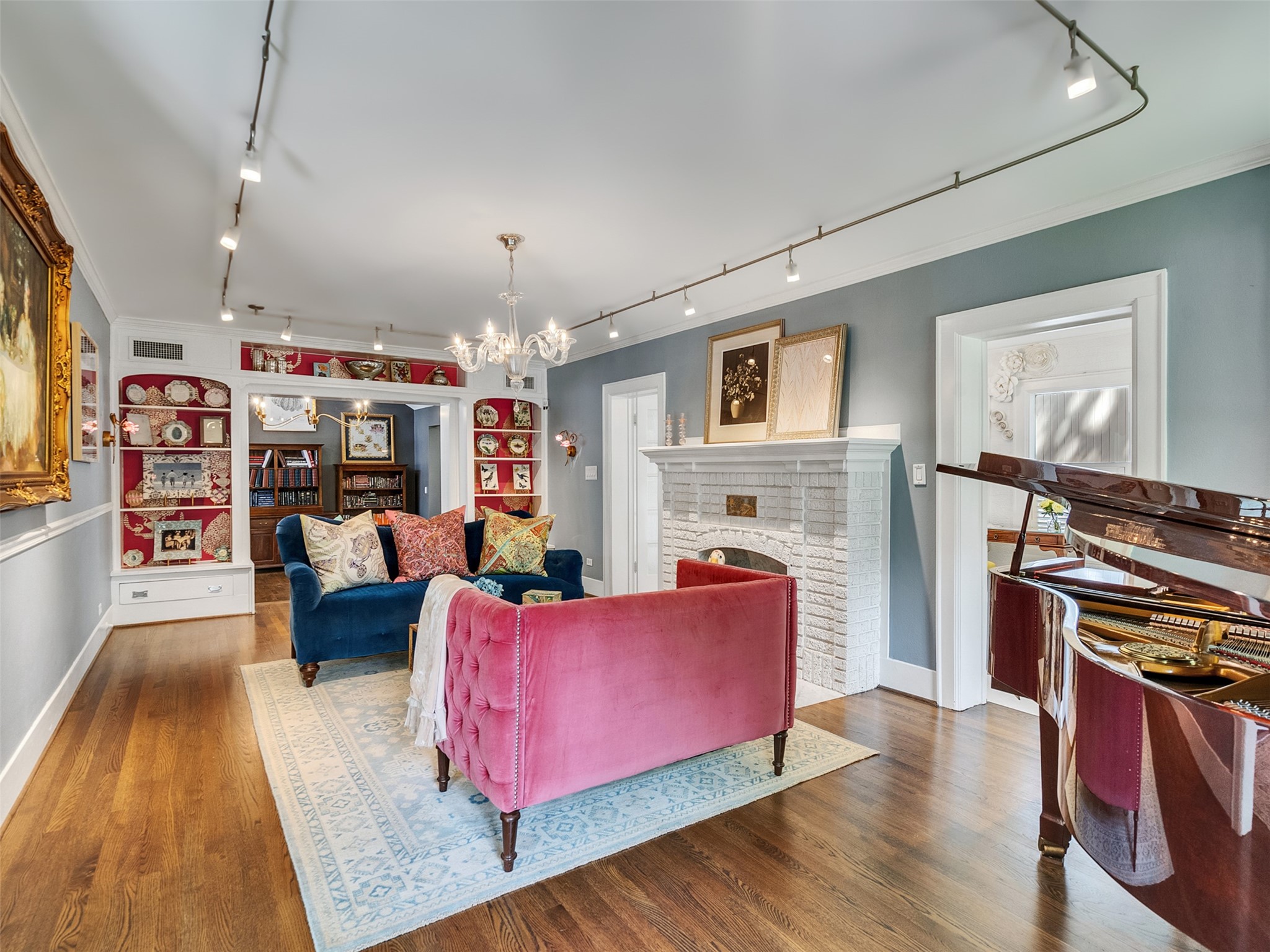 1836 Wroxton Road Houston, TX 77005 - Photo 8 of 42 Spacious formal living room, with the sun room off it and view of the family room, which opens off of it towards the back.