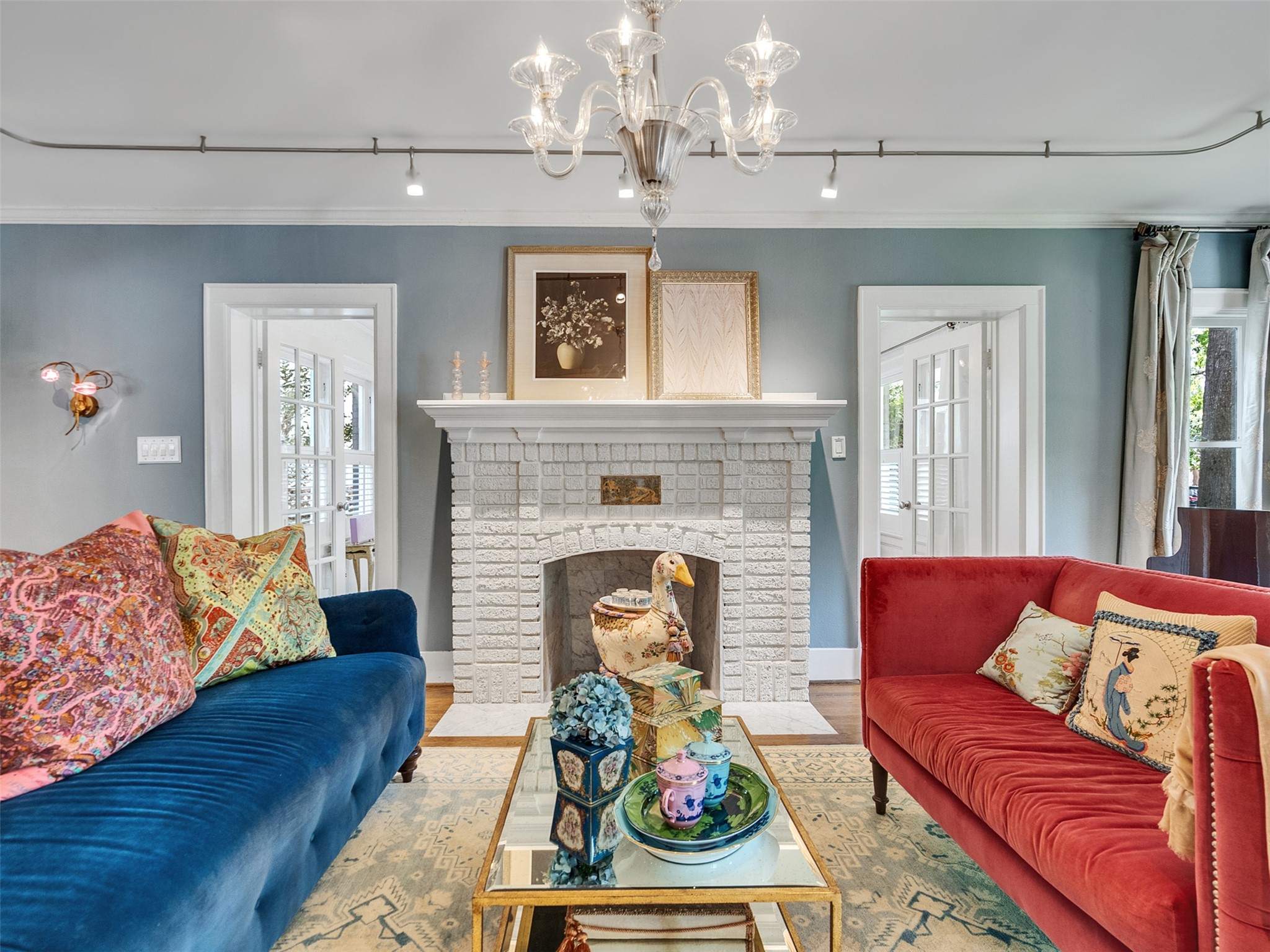 1836 Wroxton Road Houston, TX 77005 - Photo 9 of 42 Brick Fireplace with view of doors to sun room.