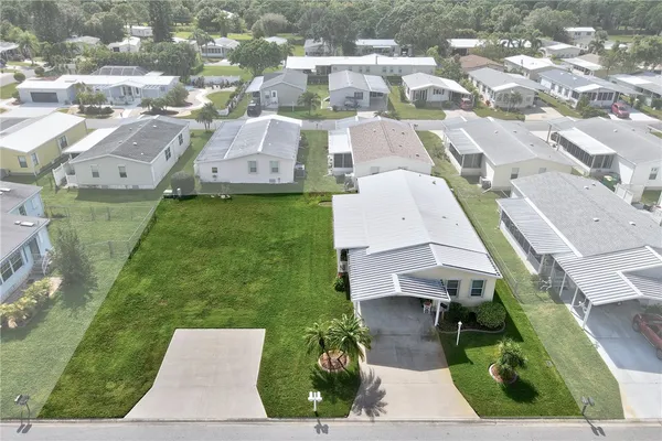 an aerial view of a house with a garden