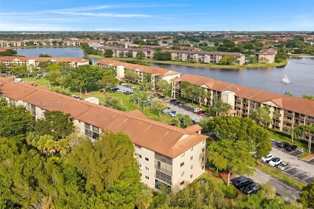 an aerial view of residential building and lake view