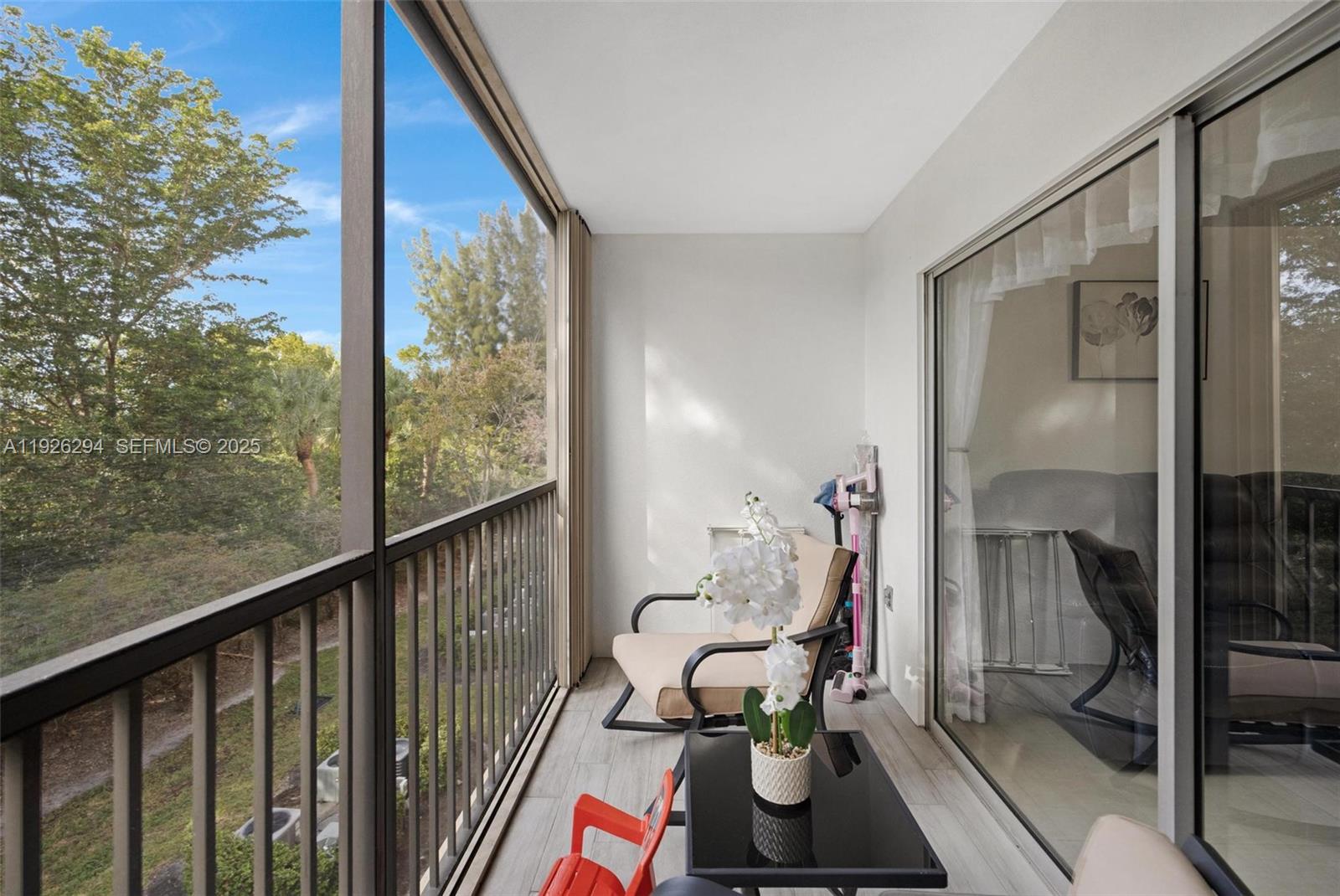 900 Southwest 142nd Avenue, Unit 306L Pembroke Pines, FL 33027 - Photo 32 of 34 a view of a balcony with chair