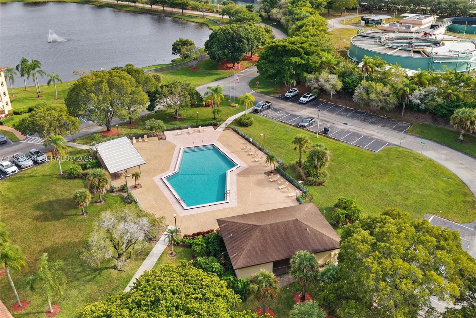 900 Southwest 142nd Avenue, Unit 306L Pembroke Pines, FL 33027 - Photo 34 of 34 an aerial view of a house with a garden and lake view
