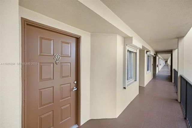 a view of a hallway with closet area