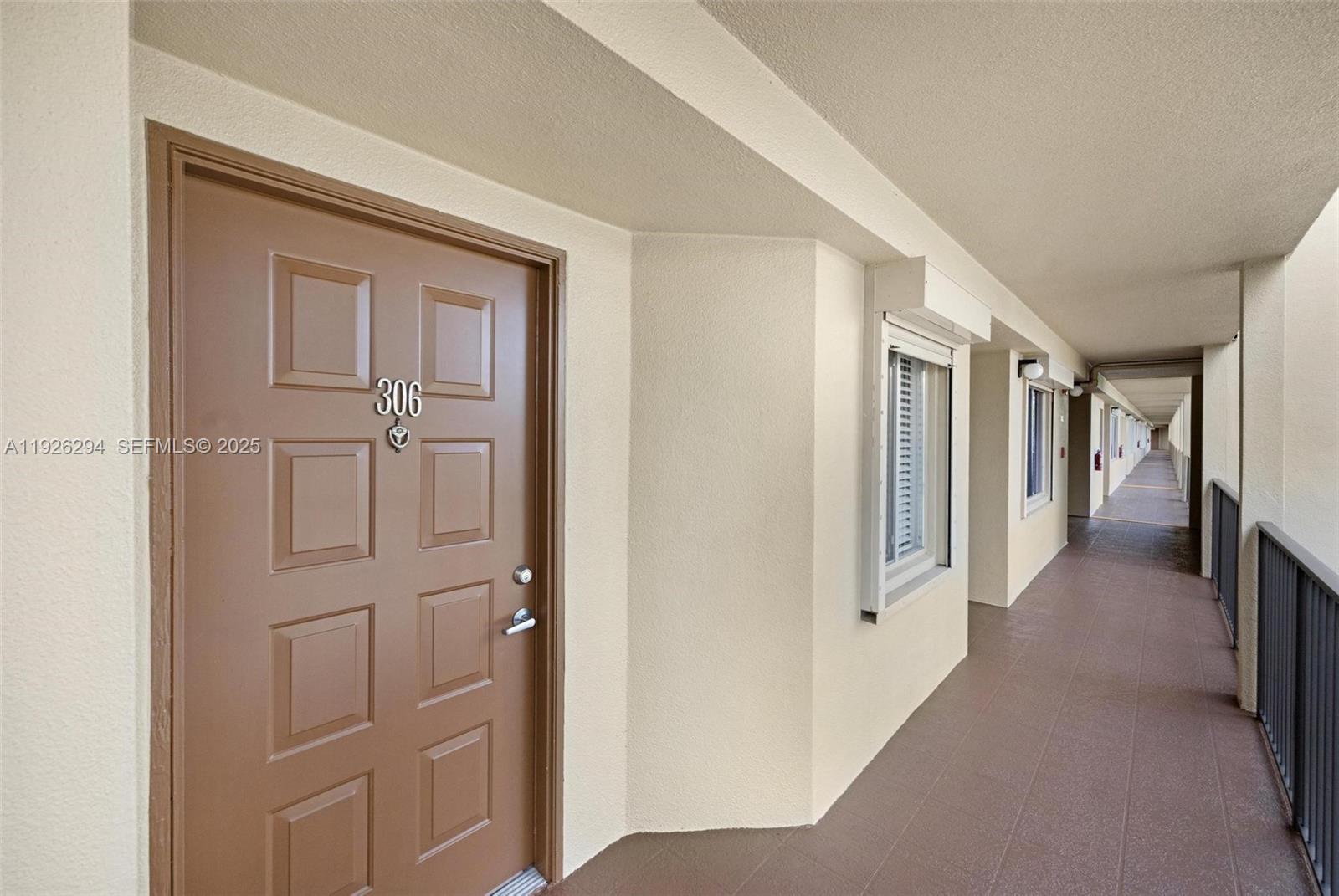 900 Southwest 142nd Avenue, Unit 306L Pembroke Pines, FL 33027 - Photo 4 of 34 a view of a hallway with closet area