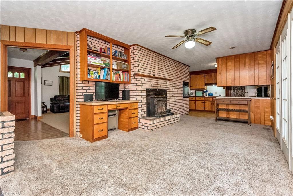 629 Froglevel Road Ronda, NC 28670 - Photo 37 of 50 Brick Ranch Dining Room w/ FP & View of Kitchen