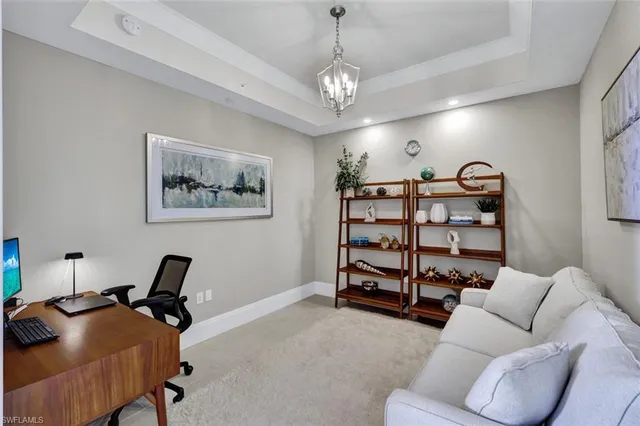 a view of a livingroom with a couch and a bookshelf