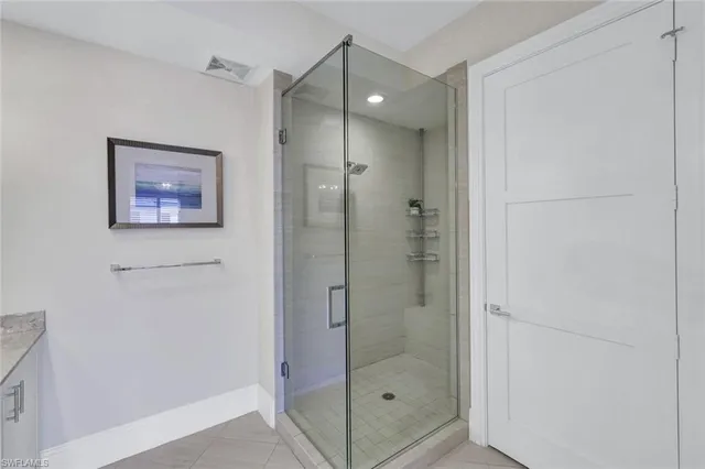 a bathroom with a shower and a sink