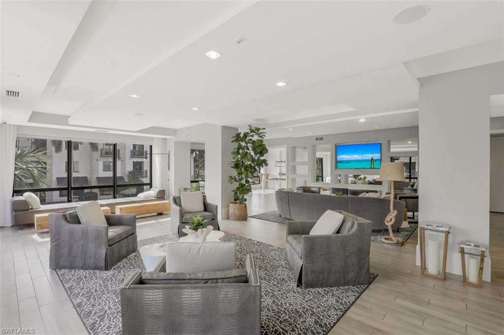 1035 3rd Avenue South, Unit 514 Naples, FL 34102 - Photo 35 of 35 a living room with furniture and a large window