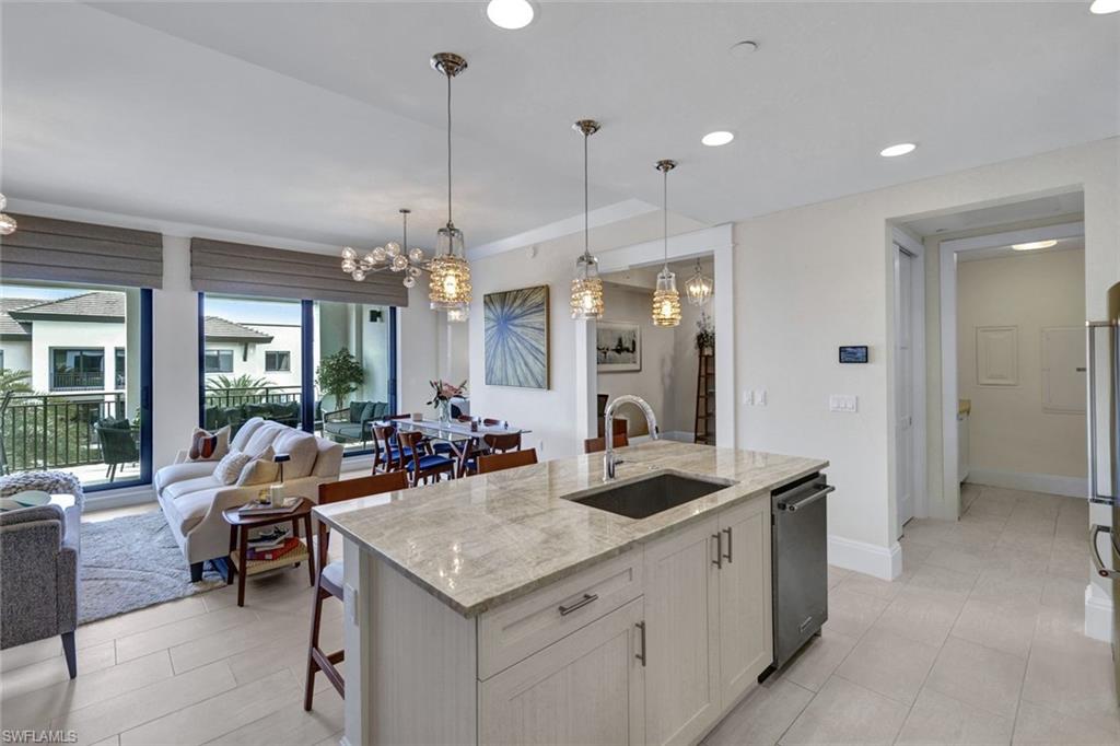 1035 3rd Avenue South, Unit 514 Naples, FL 34102 - Photo 6 of 35 a view of a a dining table chairs and chandelier