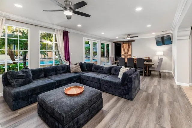 a living room with furniture and a large window