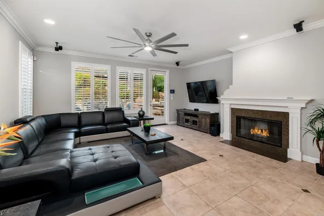 a living room with furniture fireplace and a flat screen tv