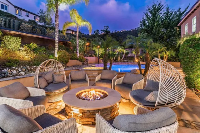 a view of a chairs and table in patio