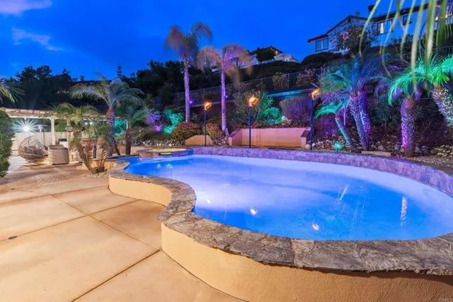 a view of a swimming pool with a patio