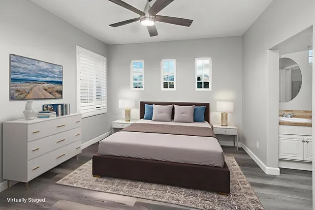 a spacious bedroom with a large bed and a window