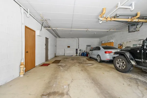 a view of parking garage with cars