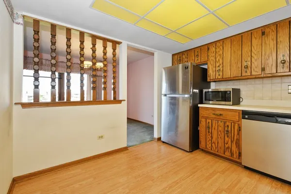 a kitchen with stainless steel appliances a refrigerator and a sink