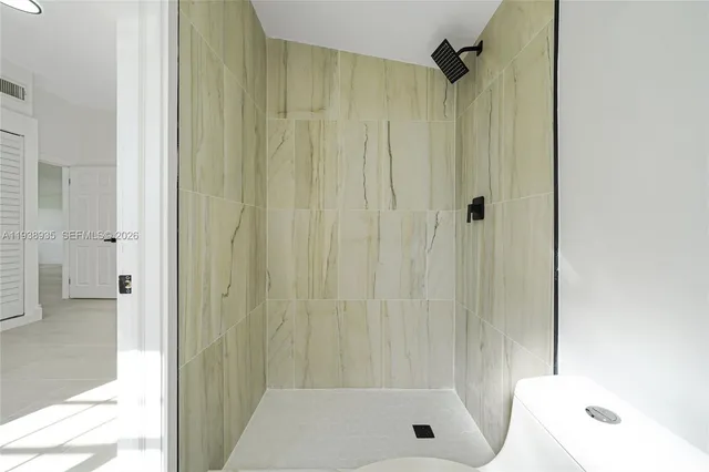 a bathroom with a shower and a tub
