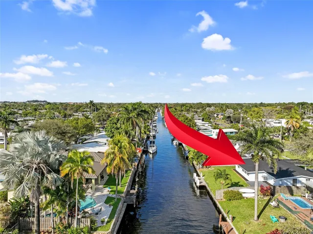 a view of a house with backyard porch and sitting area