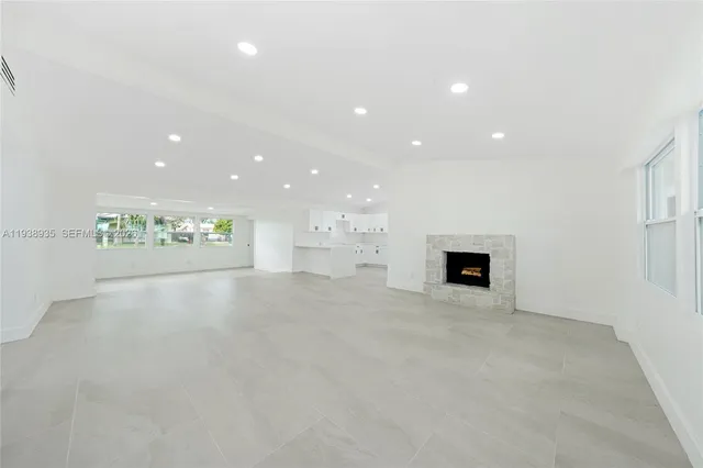 an empty room with fireplace