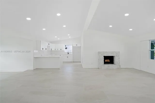 a view of kitchen with white cabinets