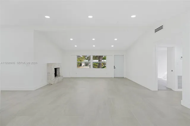 a kitchen with white cabinets