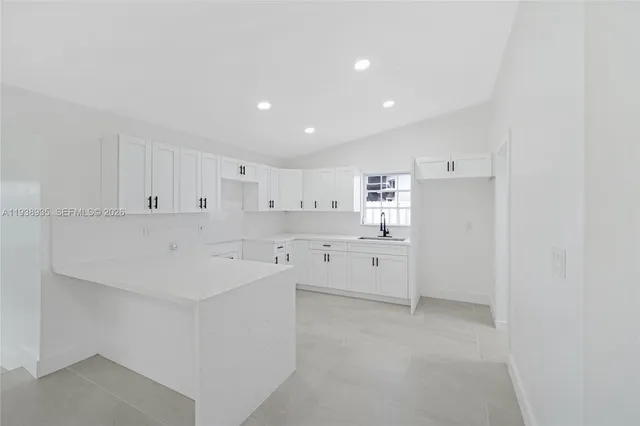 a view of a lake with a house in the background