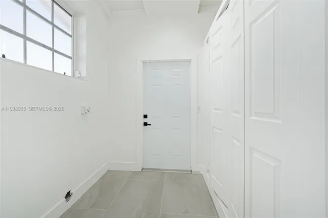 an empty room with windows
