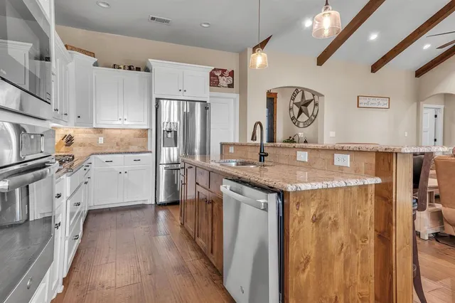 a bedroom with a bed and a ceiling fan