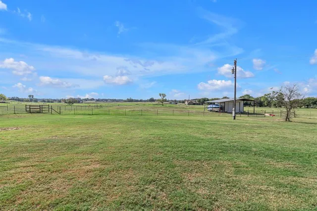 a view of a lake with houses in the background