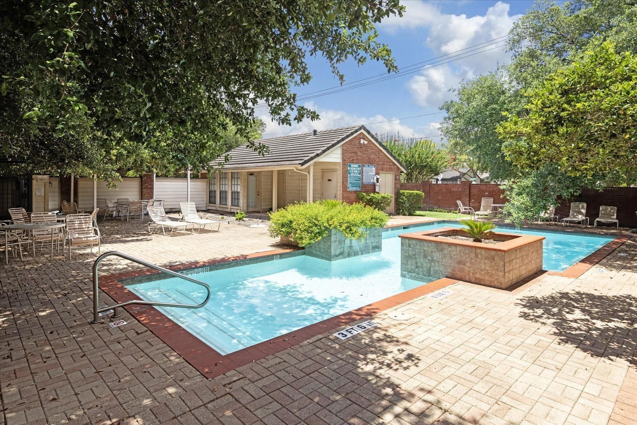 2211 South Kirkwood Road, Unit 9 Houston, TX 77077 - Photo 15 of 16 a swimming pool with outdoor seating and yard