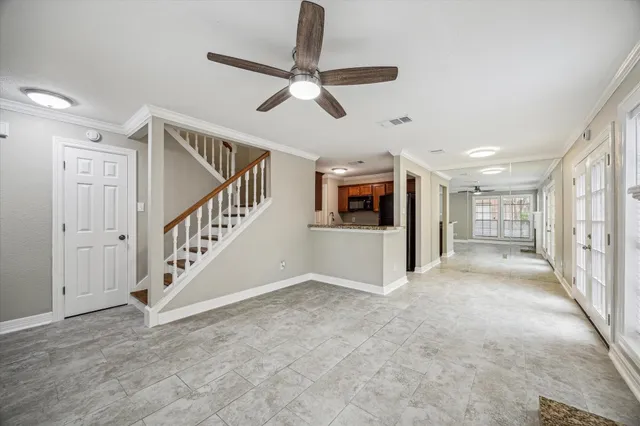 a view of entryway and hall with a front door