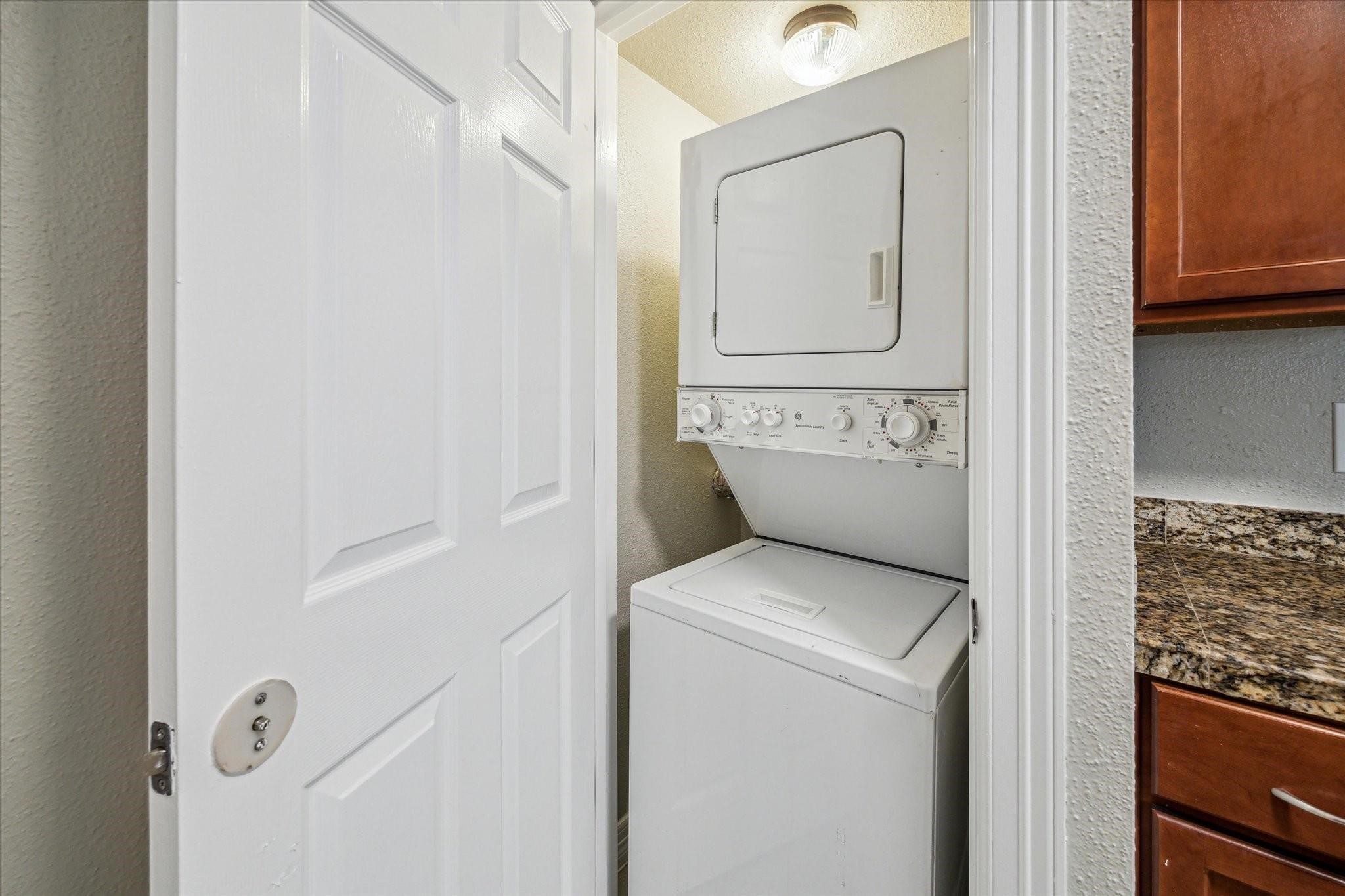 2211 South Kirkwood Road, Unit 9 Houston, TX 77077 - Photo 10 of 16 a utility room with dryer and washer