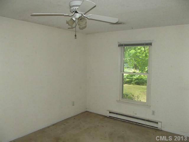 6019 Trotters Ridge Road Charlotte, NC 28227 - Photo 7 of 9 an empty room with a window