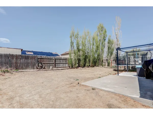 a house view with a backyard space