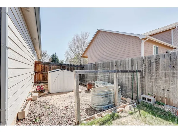 a view of a backyard with furniture and staircase